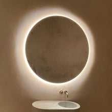 Orbis™ back Illuminated round mirror with an elegant bronze patina brass frame