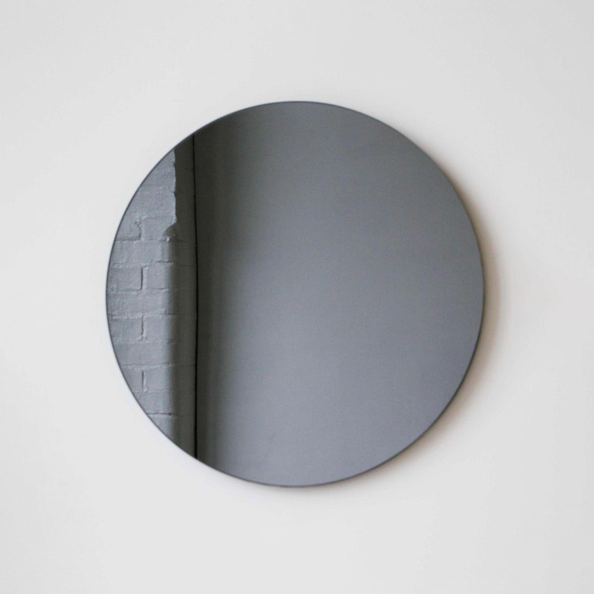 Orbis™ Contemporary Black Tinted Round Frameless Mirror