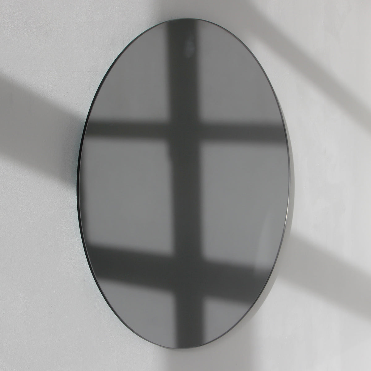 Orbis™ Contemporary Black Tinted Round Frameless Mirror