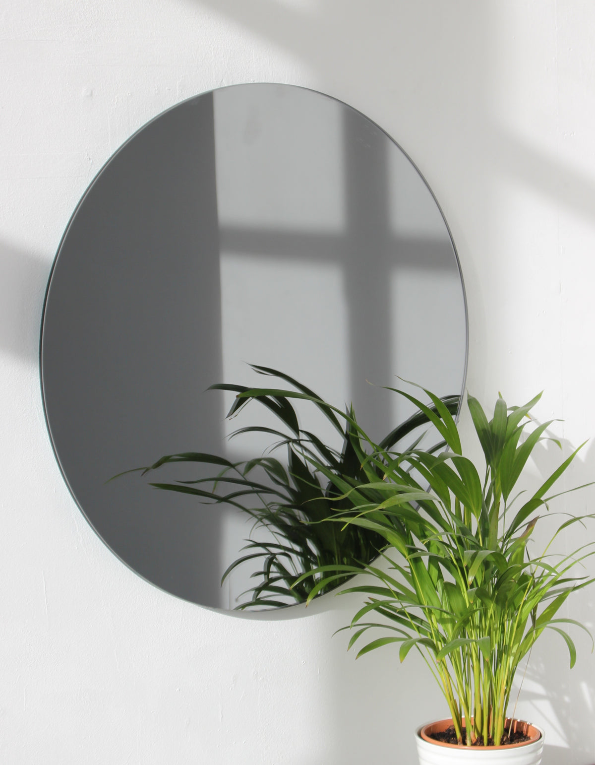 Orbis™ Contemporary Black Tinted Round Frameless Mirror