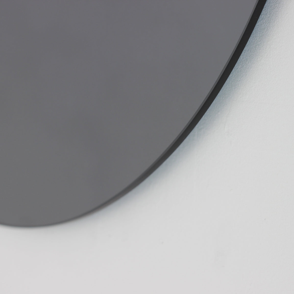 Orbis™ Contemporary Black Tinted Round Frameless Mirror