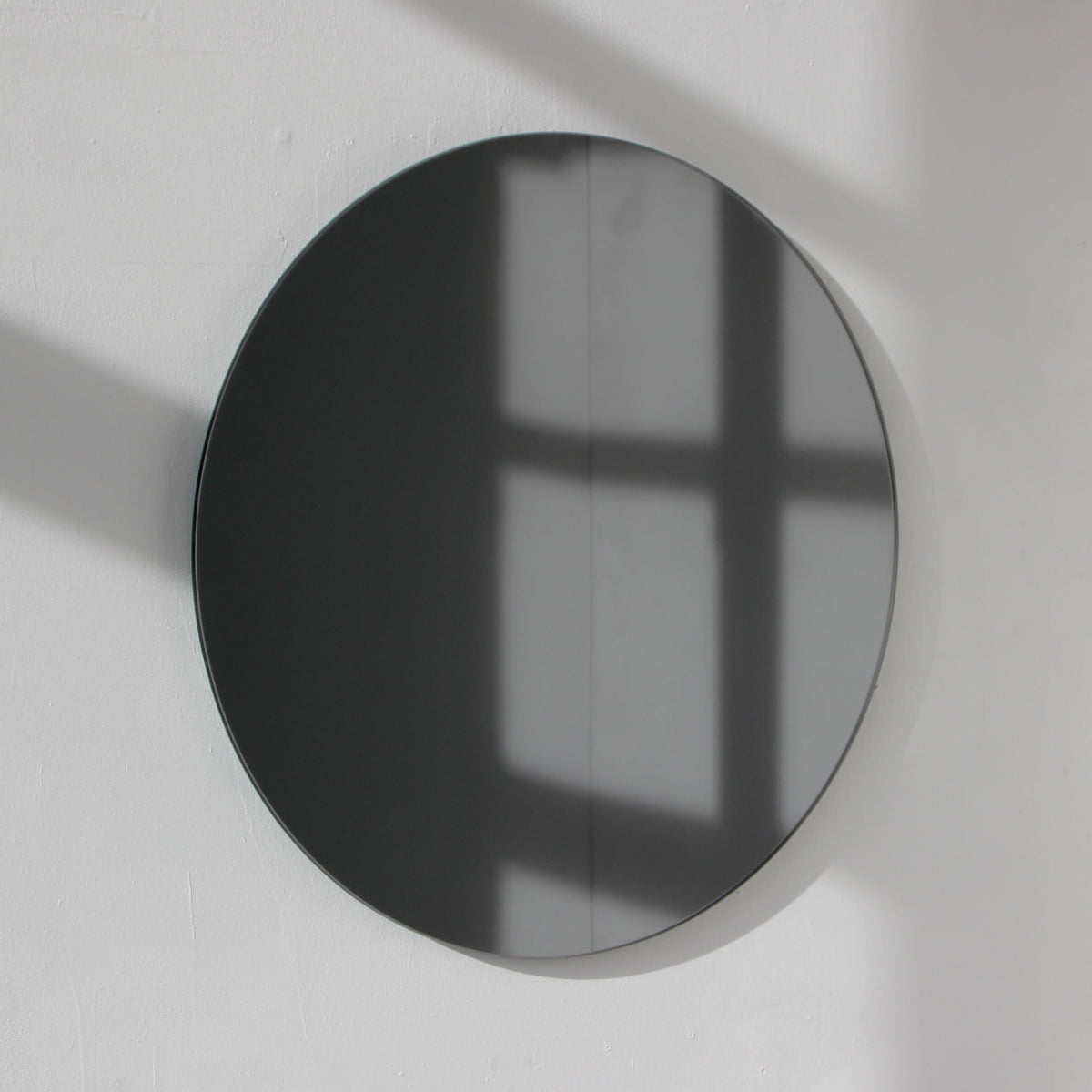 Orbis™ Contemporary Black Tinted Round Frameless Mirror