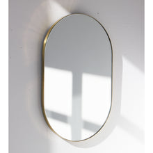 Capsula™ Suspended Capsule shaped Bathroom Mirror with a Brushed Brass Frame
