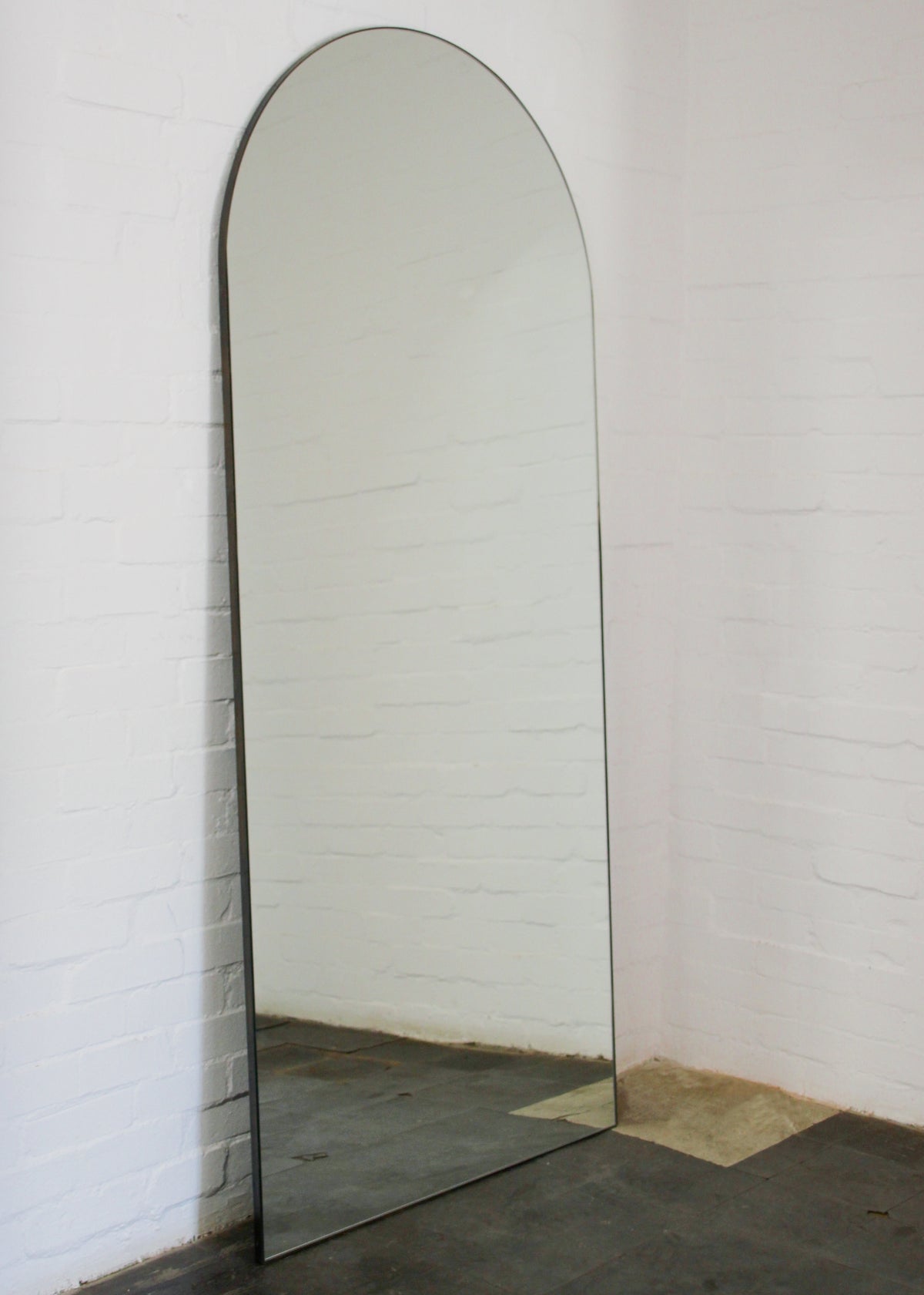 Arcus™ Arch shaped Oversized Wall-leaning Modern Mirror with a Brass Frame
