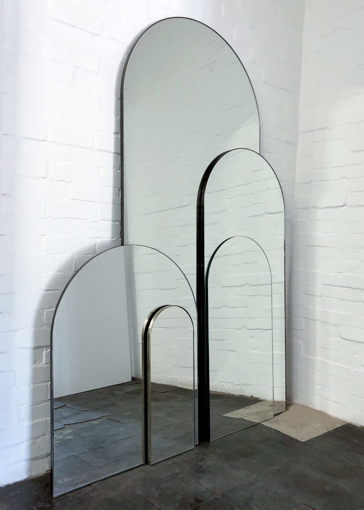 Arcus™ Arch shaped Oversized Wall-leaning Modern Mirror with a Brass Frame