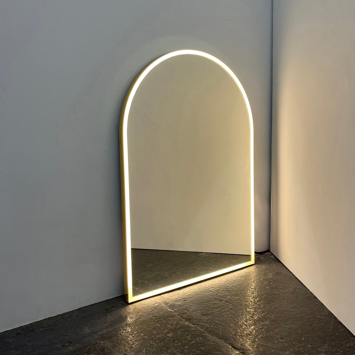 Arcus™ Front Illuminated Arched Contemporary Mirror with a Brass Frame
