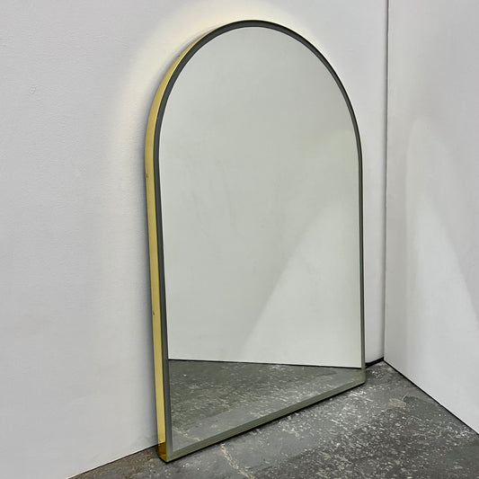 Contemporary front illuminated arch shaped Arcus™ mirror with a solid brass frame