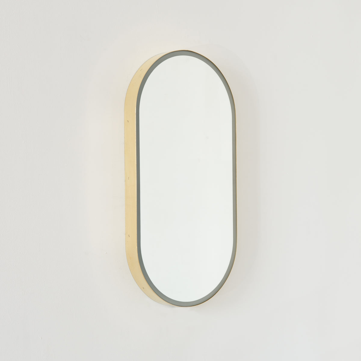 Capsula™ Front Illuminated Capsule shaped Mirror with Elegant Brushed Brass Frame, Customisable
