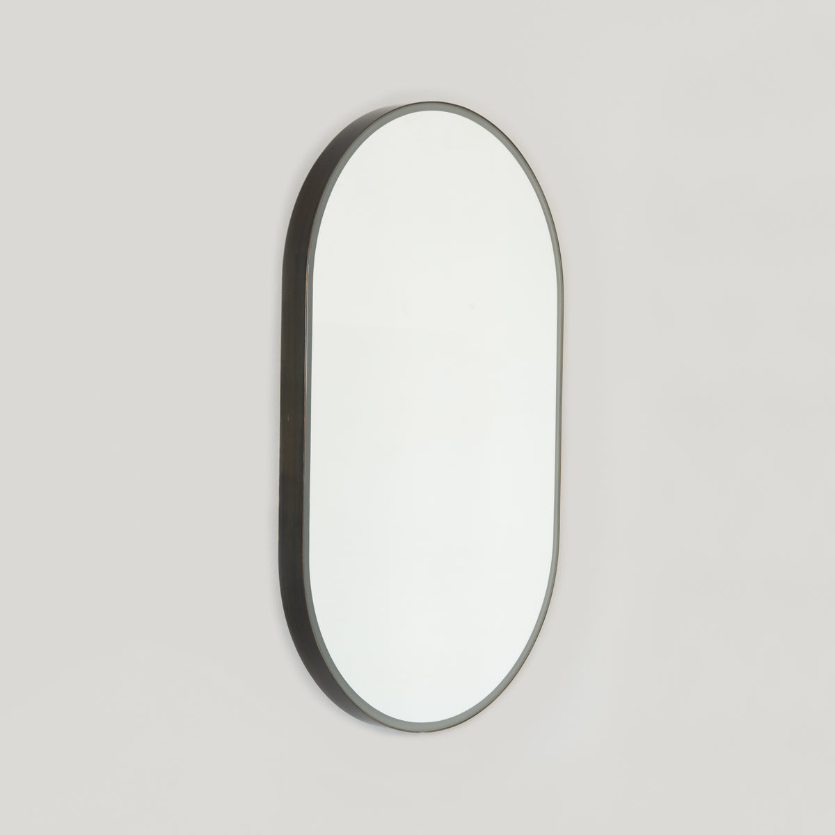 Capsula™ Front Illuminated Capsule shaped Mirror with Bronze Patina Brass Frame, Customisable