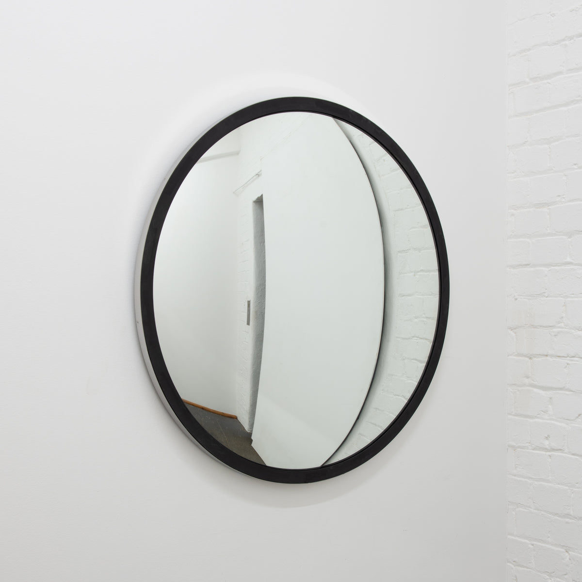 Orbis™ Round Convex Mirror with a Black Timber and a Polished Stainless Steel Frame