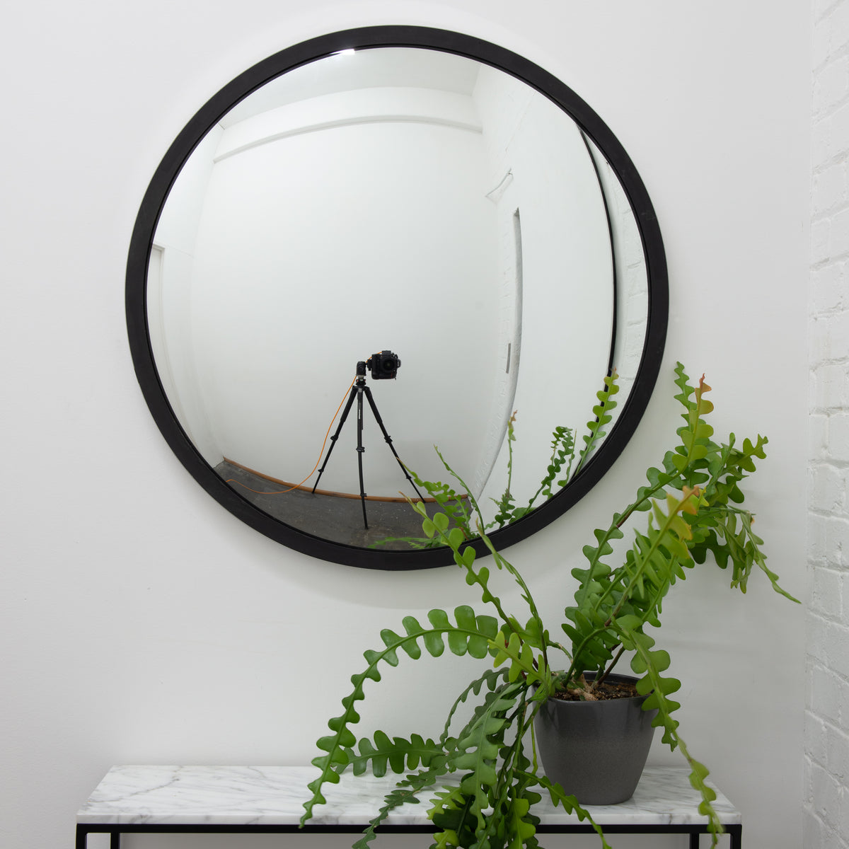 Orbis™ Round Convex Mirror with a Black Timber and a Polished Stainless Steel Frame