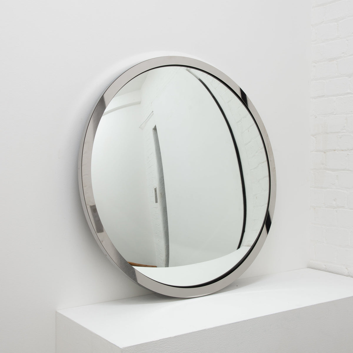 In Stock Orbis Round Convex Mirror with a Polished Stainless Steel Frame