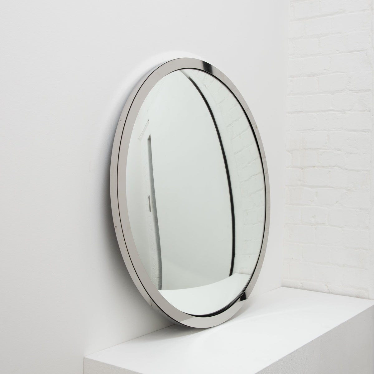 In Stock Orbis Round Convex Mirror with a Polished Stainless Steel Frame