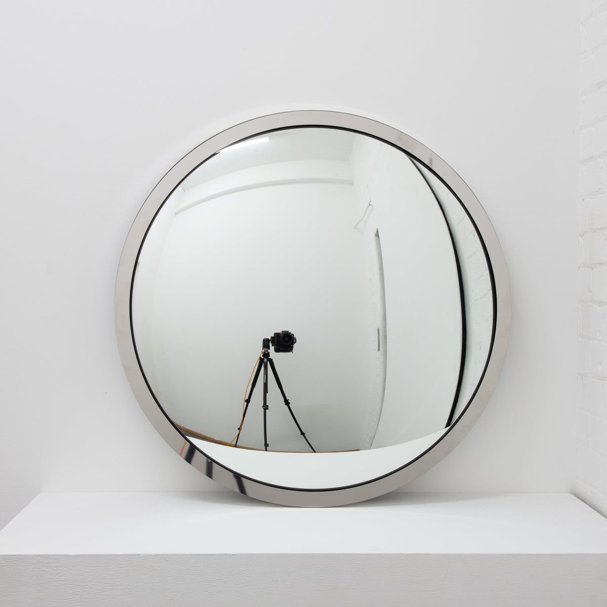 In Stock Orbis Round Convex Mirror with a Polished Stainless Steel Frame