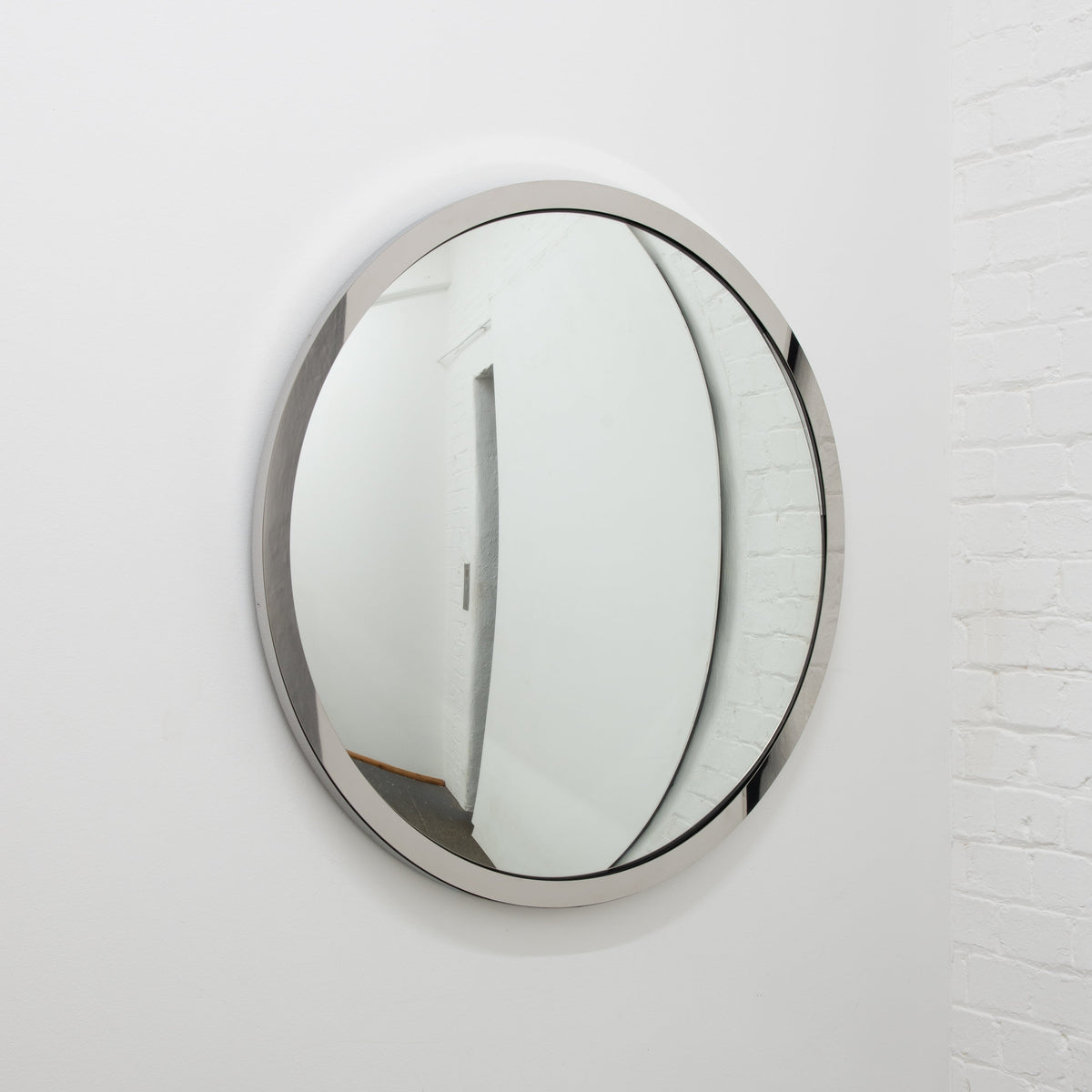 In Stock Orbis Round Convex Mirror with a Polished Stainless Steel Frame