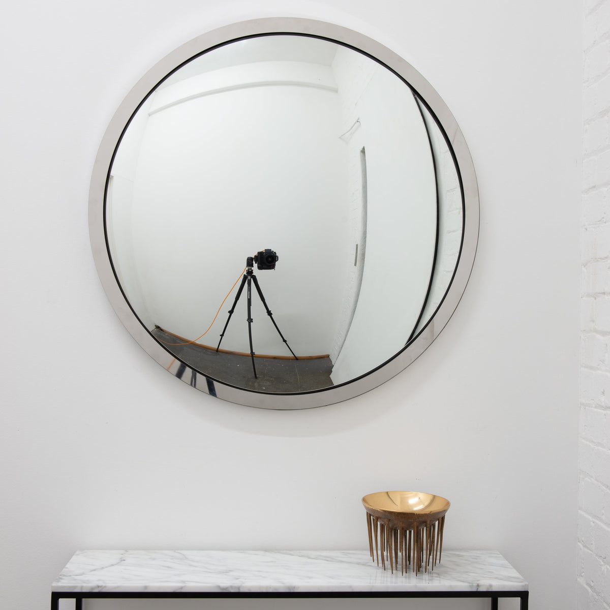 In Stock Orbis Round Convex Mirror with a Polished Stainless Steel Frame