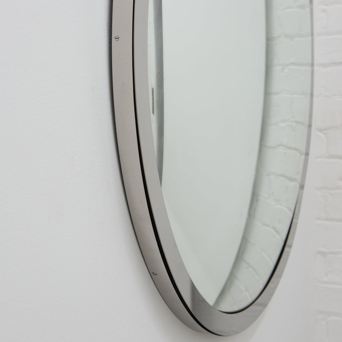 In Stock Orbis Round Convex Mirror with a Polished Stainless Steel Frame