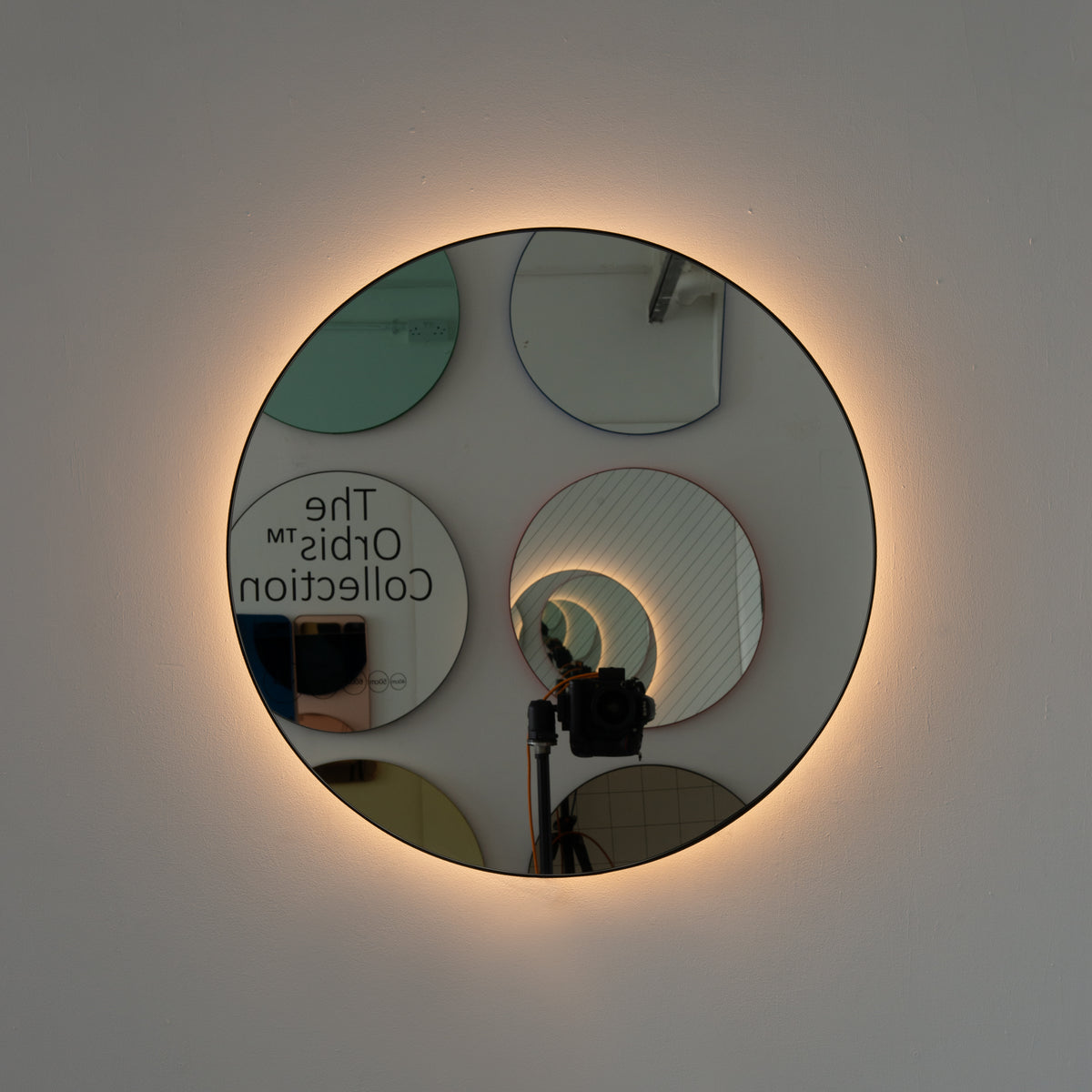 Orbis™ Illuminated Contemporary Round Mirror with a Bronze Patina Brass Frame