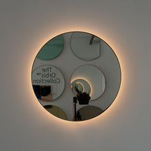 Orbis™ Illuminated Contemporary Round Mirror with a Bronze Patina Brass Frame