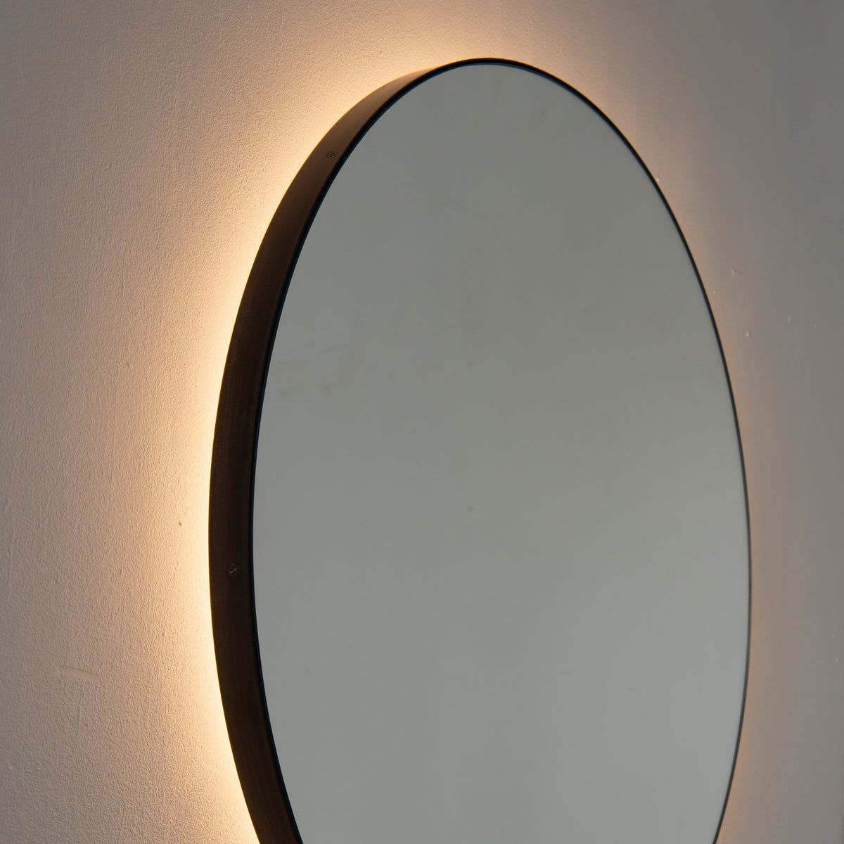 Orbis™ Illuminated Contemporary Round Mirror with a Bronze Patina Brass Frame