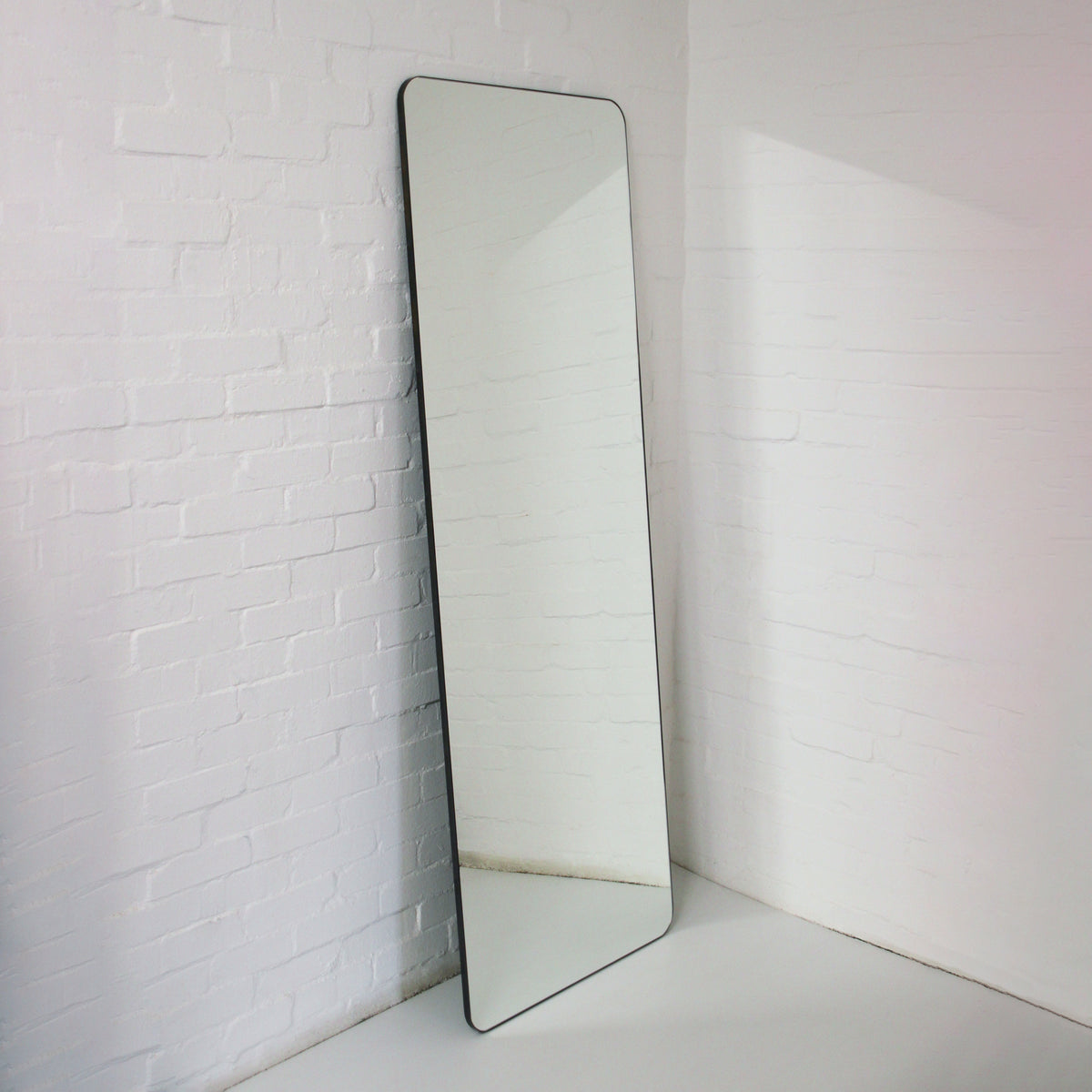 Wall Leaning Quadris™ Floor Mirror with a Bronze Patina Brass Frame