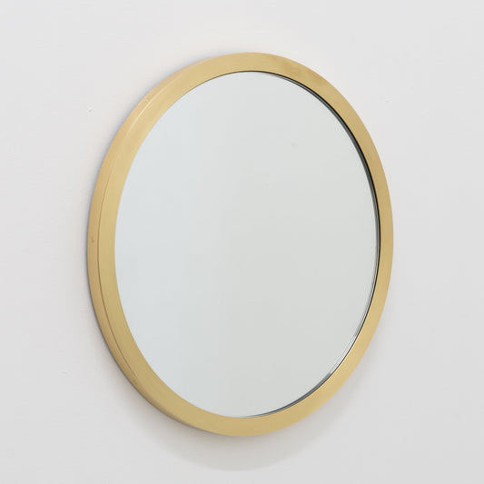 Orbis™ round mirror with a full solid brushed brass frame