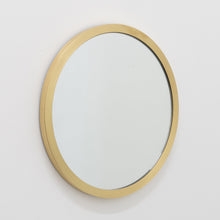 Orbis™ round mirror with a full solid brushed brass frame