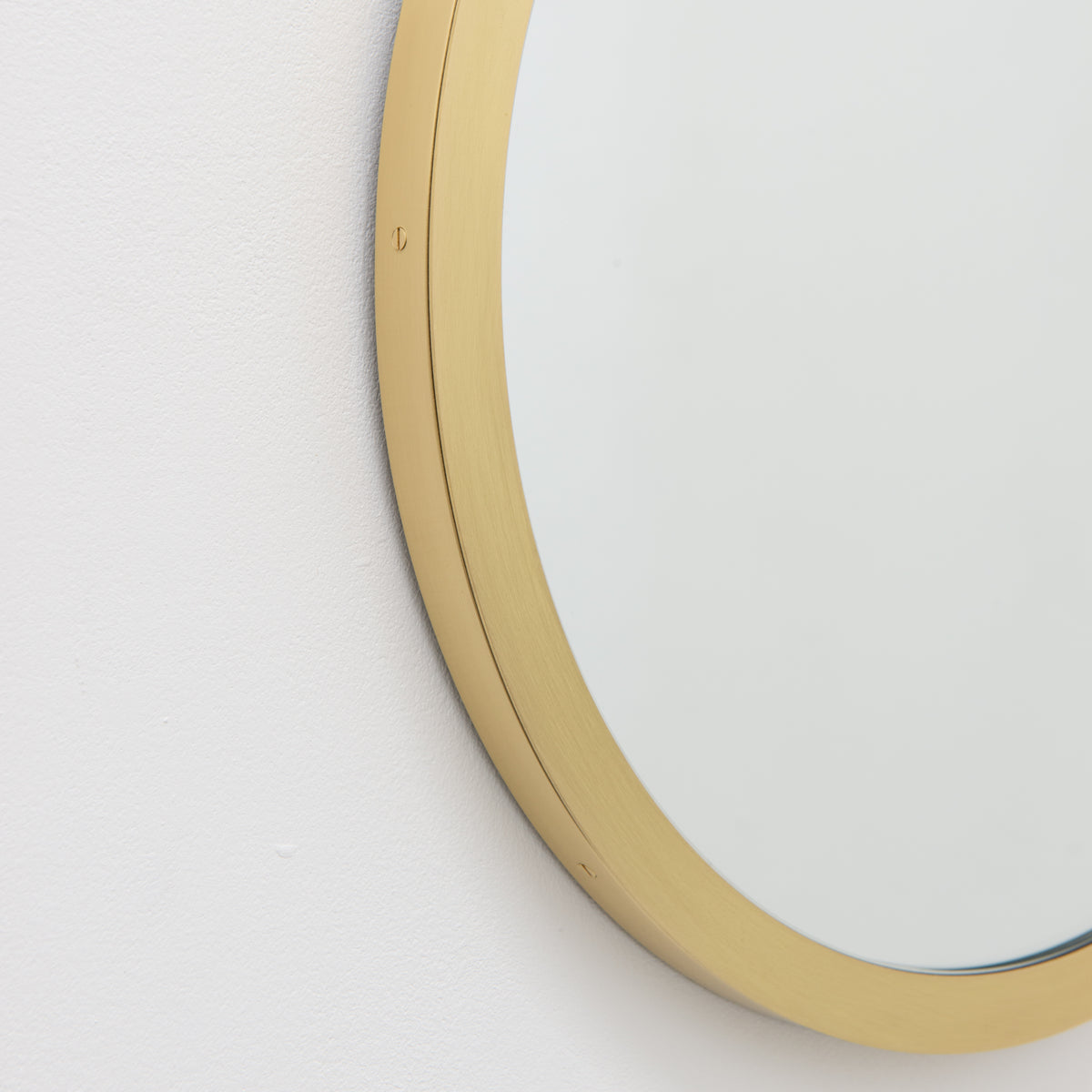 Orbis™ Round Mirror with a Handcrafted Brass Full Frame
