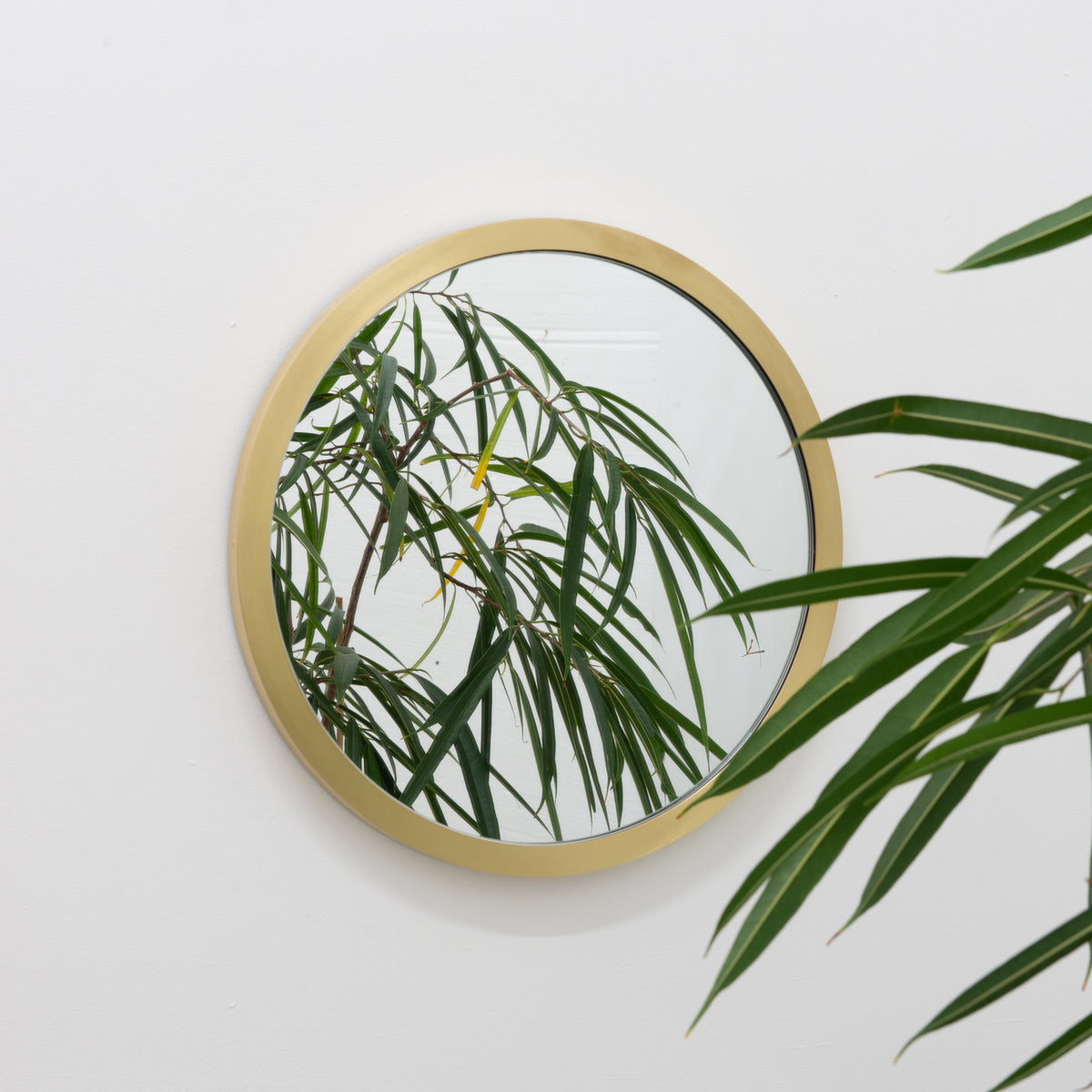 Orbis™ Round Mirror with a Handcrafted Brass Full Frame