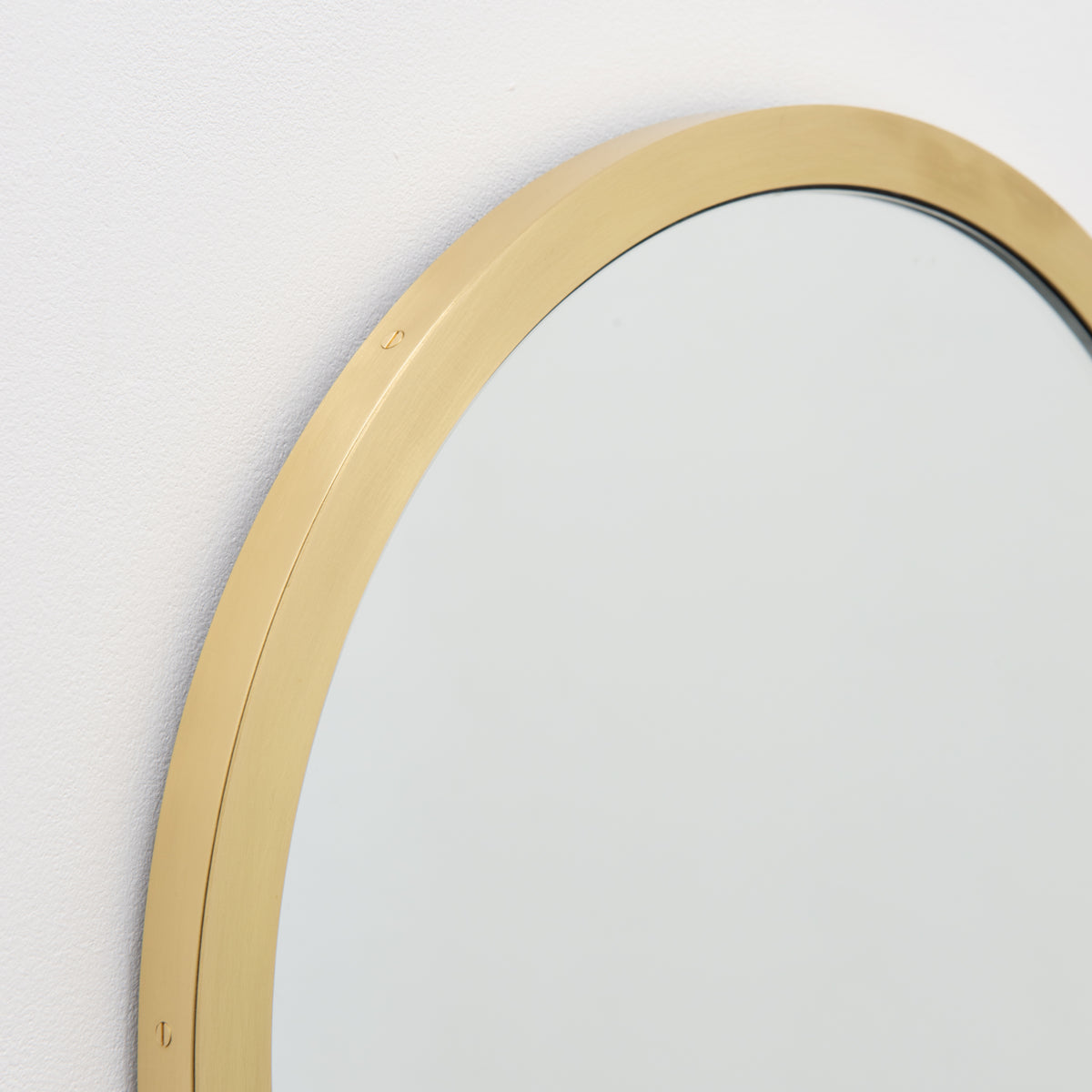 Orbis™ Round Mirror with a Handcrafted Brass Full Frame