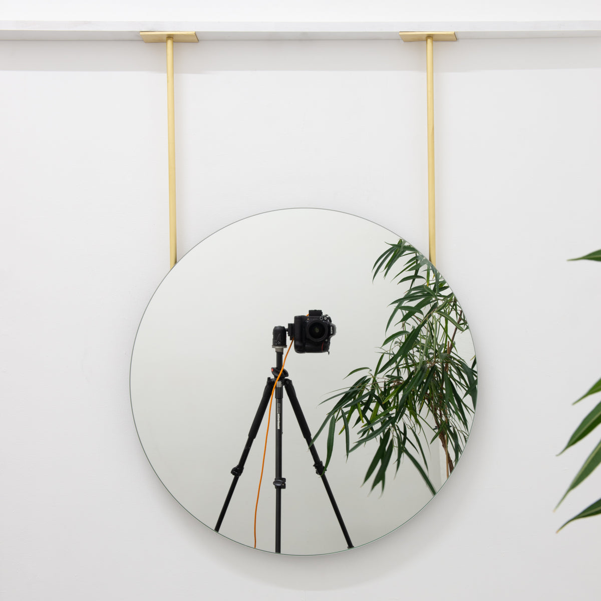 Orbis™ Frameless Ceiling Hanging Suspended Round Mirror with Two Brass Arms