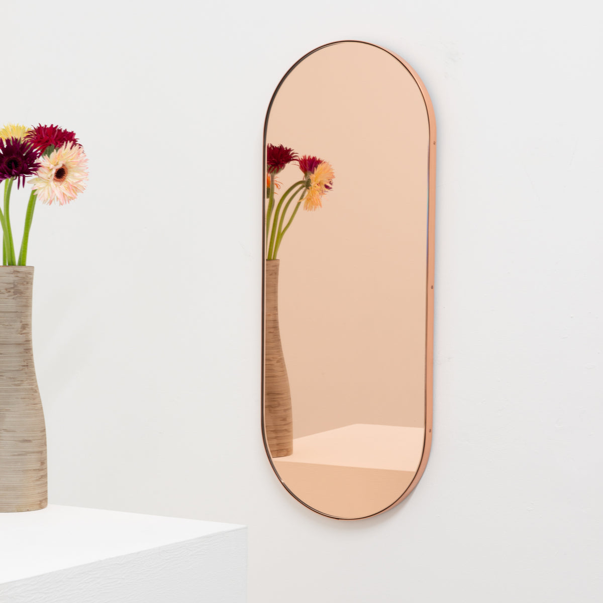 Capsula™ Capsule shaped Rose Gold Contemporary Mirror with a Copper Frame