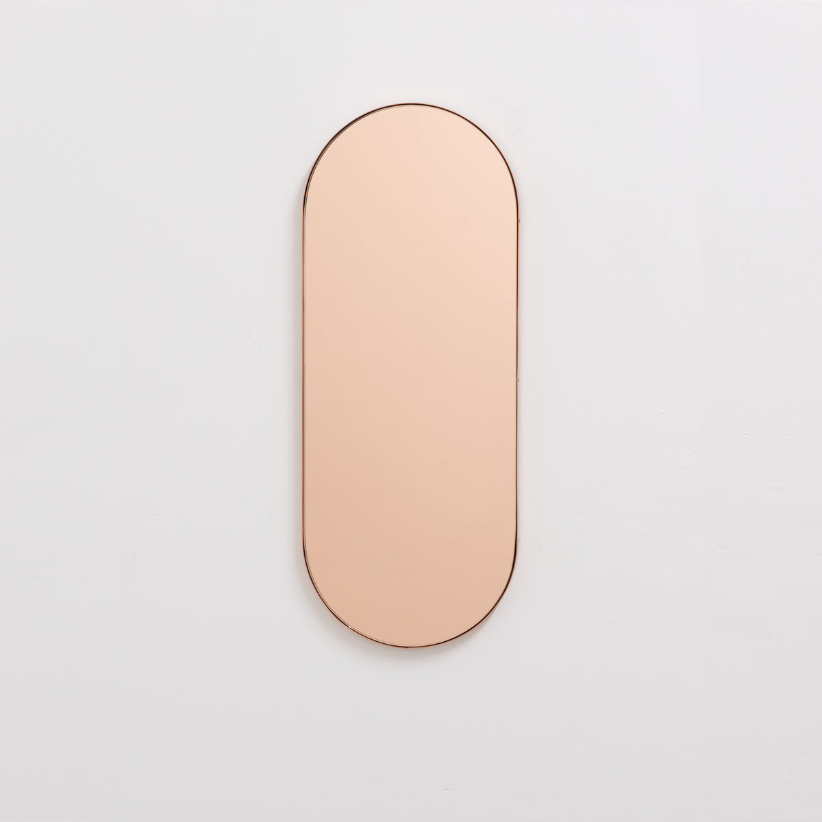 Capsula™ Capsule shaped Rose Gold Contemporary Mirror with a Copper Frame