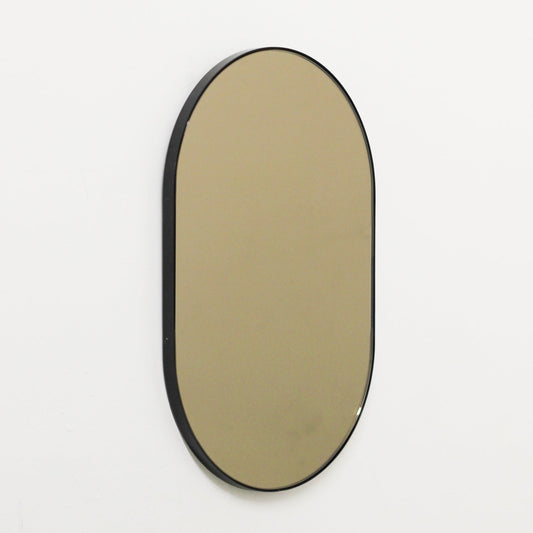 Capsula™ Capsule shaped Bronze Contemporary Mirror with a Black Frame