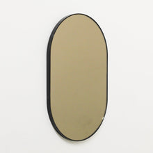 Capsula™ Capsule shaped Bronze Contemporary Mirror with a Black Frame