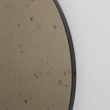 Orbis™ Antiqued Bronze Tinted Round Elegant Mirror with a Black Frame