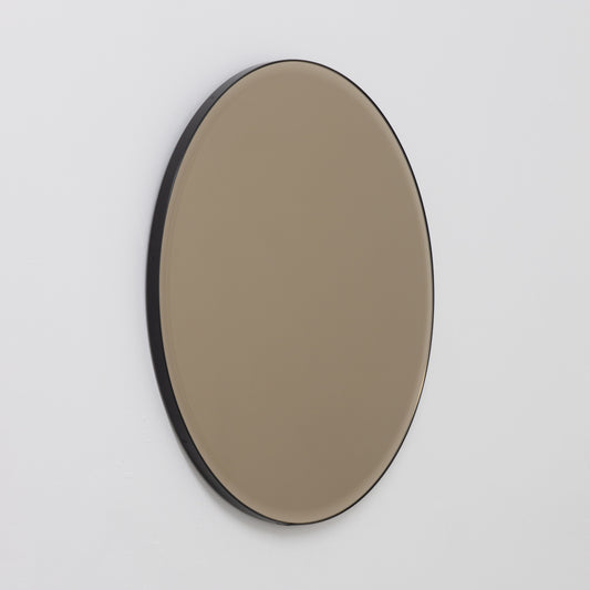 In Stock Orbis™ Bevelled Bronze Tinted Round Mirror with a Black Metal Frame