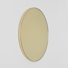 In Stock Orbis Round Gold Tinted Contemporary Mirror with a Brass Frame