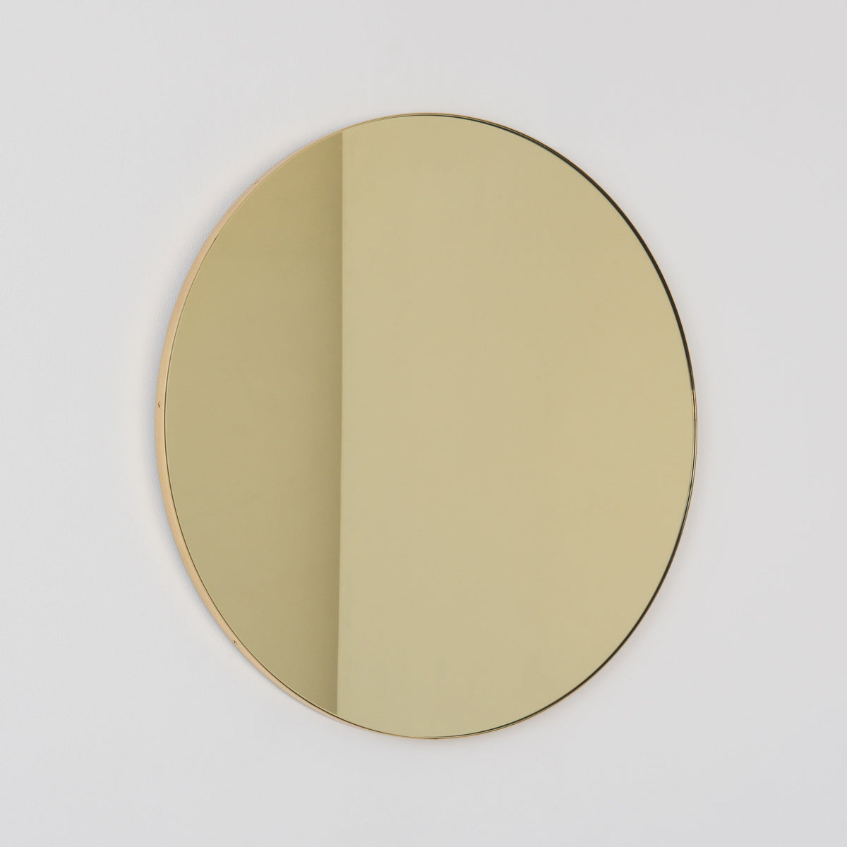 In Stock Orbis Round Gold Tinted Contemporary Mirror with a Brass Frame