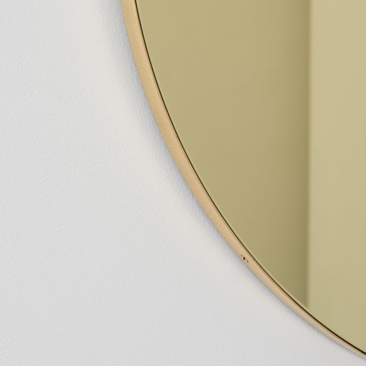 Orbis™ Round Gold Tinted Contemporary Mirror with a Brass Frame