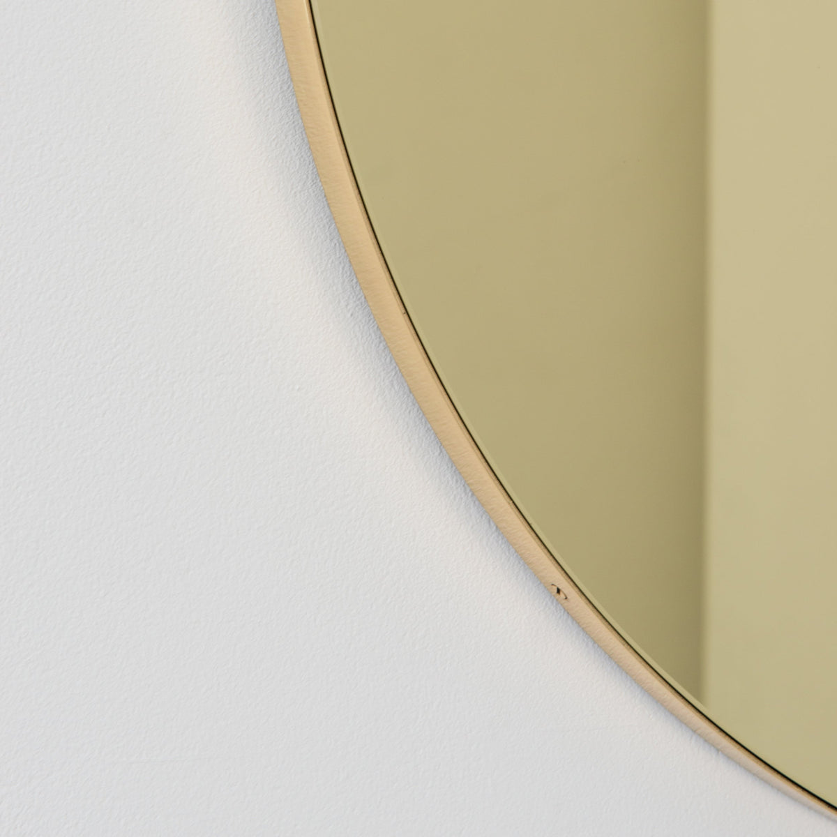In Stock Orbis Round Gold Tinted Contemporary Mirror with a Brass Frame