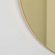 Orbis™ Round Gold Tinted Contemporary Mirror with a Brass Frame