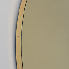 Orbis™ Round Gold Tinted Contemporary Mirror with a Brass Frame