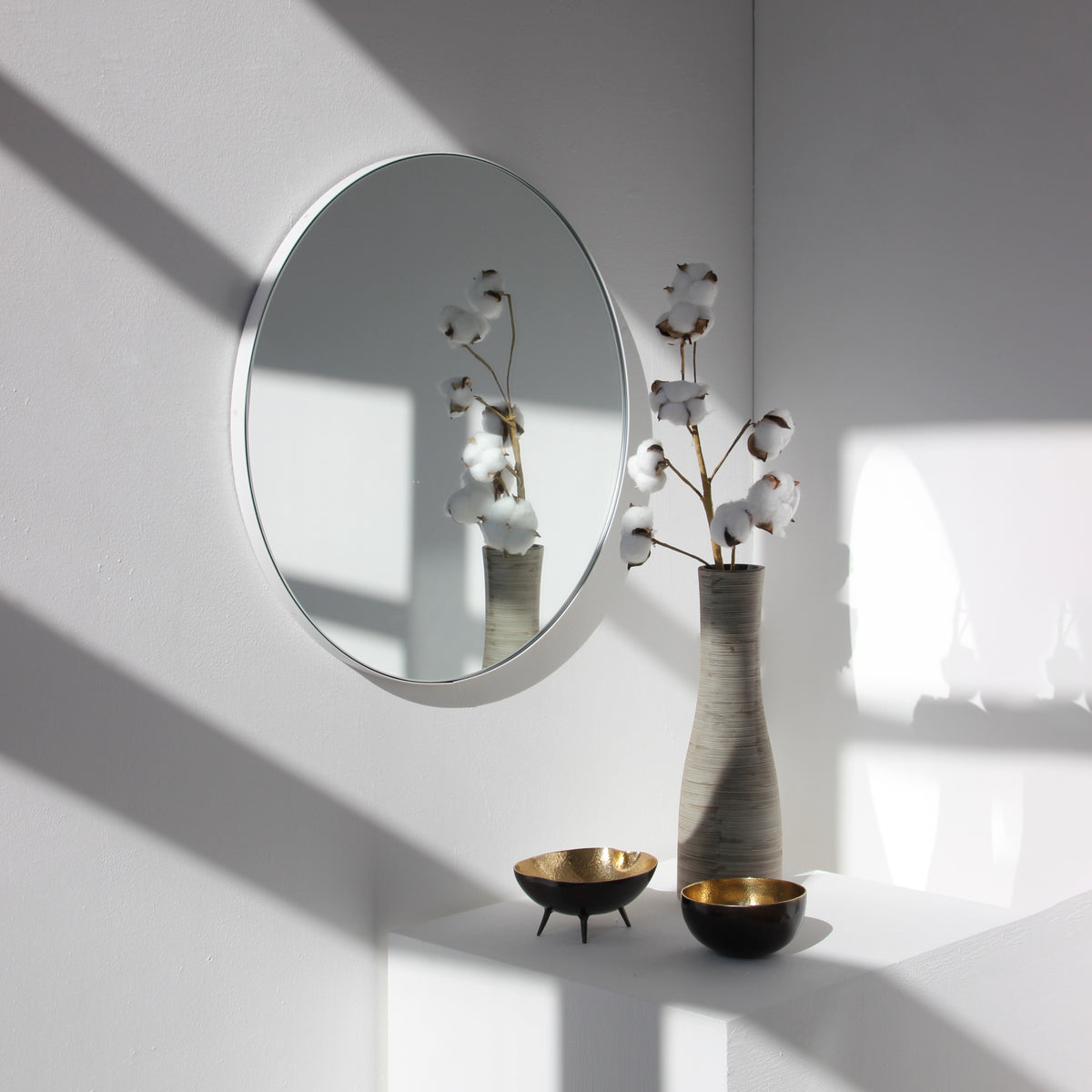 Orbis™ Round Minimalist Mirror with a Modern White Frame