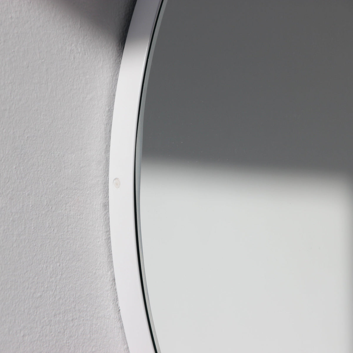 Orbis™ Round Minimalist Mirror with a Modern White Frame