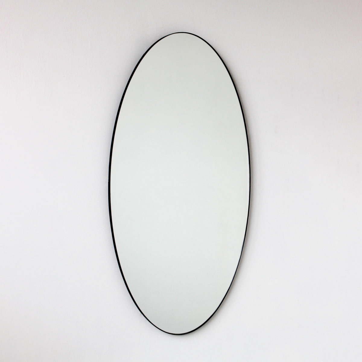 Ovalis™ Oval shaped Contemporary Mirror with a Black Frame, Customisable