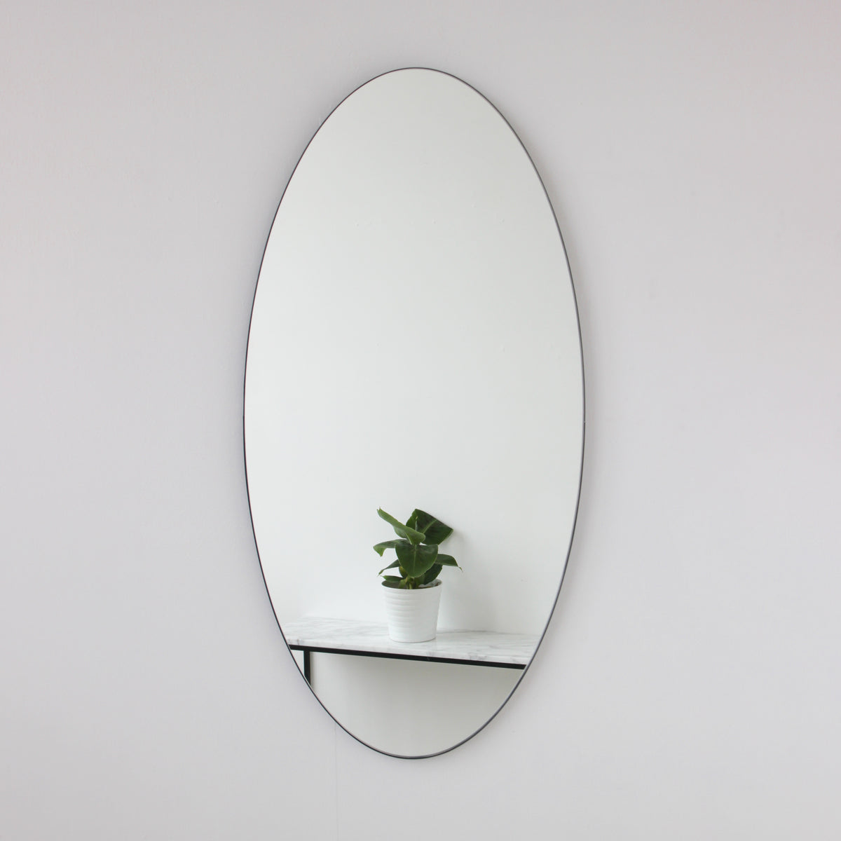 Ovalis™ Oval shaped Contemporary Mirror with a Black Frame, Customisable