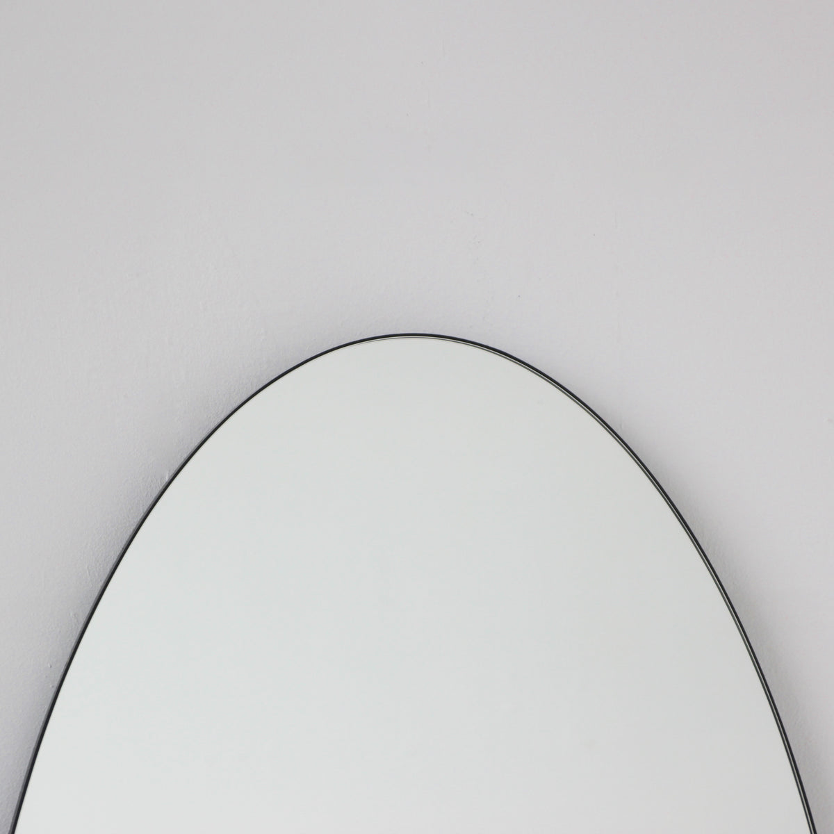 Ovalis™ Oval shaped Contemporary Mirror with a Black Frame, Customisable