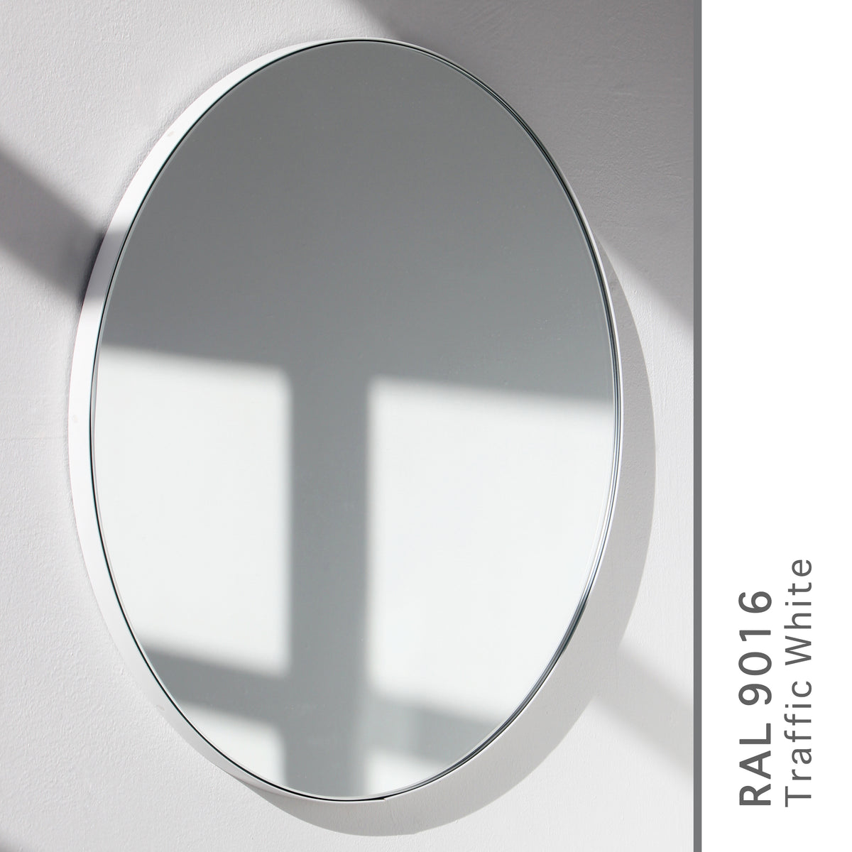 Orbis™ Round Minimalist Mirror with a Modern White Frame