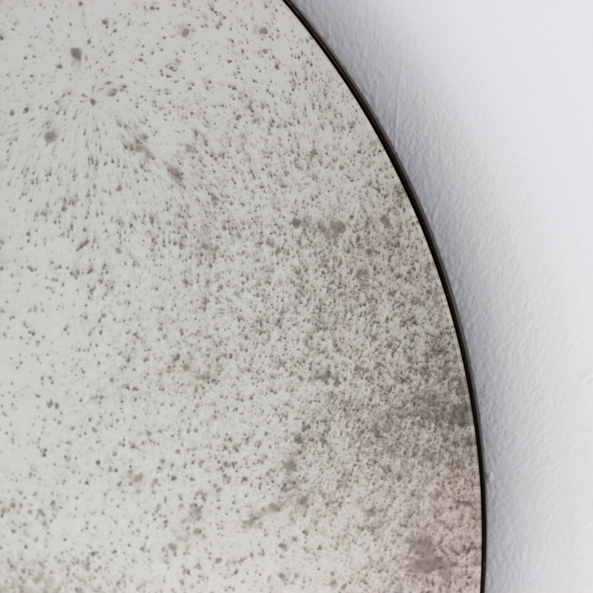 Orbis™ Antiqued Round Mirror with a Handcrafted Bronze Patina Frame